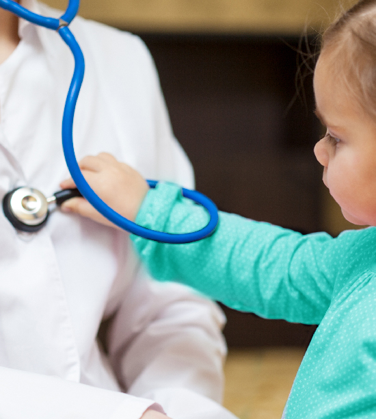 young girl using a stethoscope