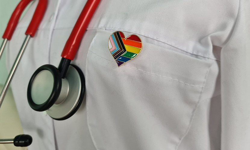 Doctor wearing a pride pin